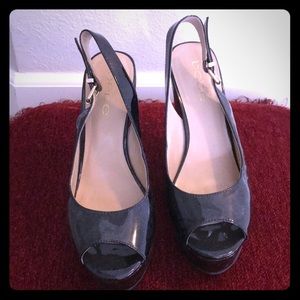 Bebe black patent leather wedges